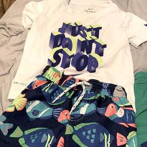Toddler’s Nike top with Carter’s swim shorts